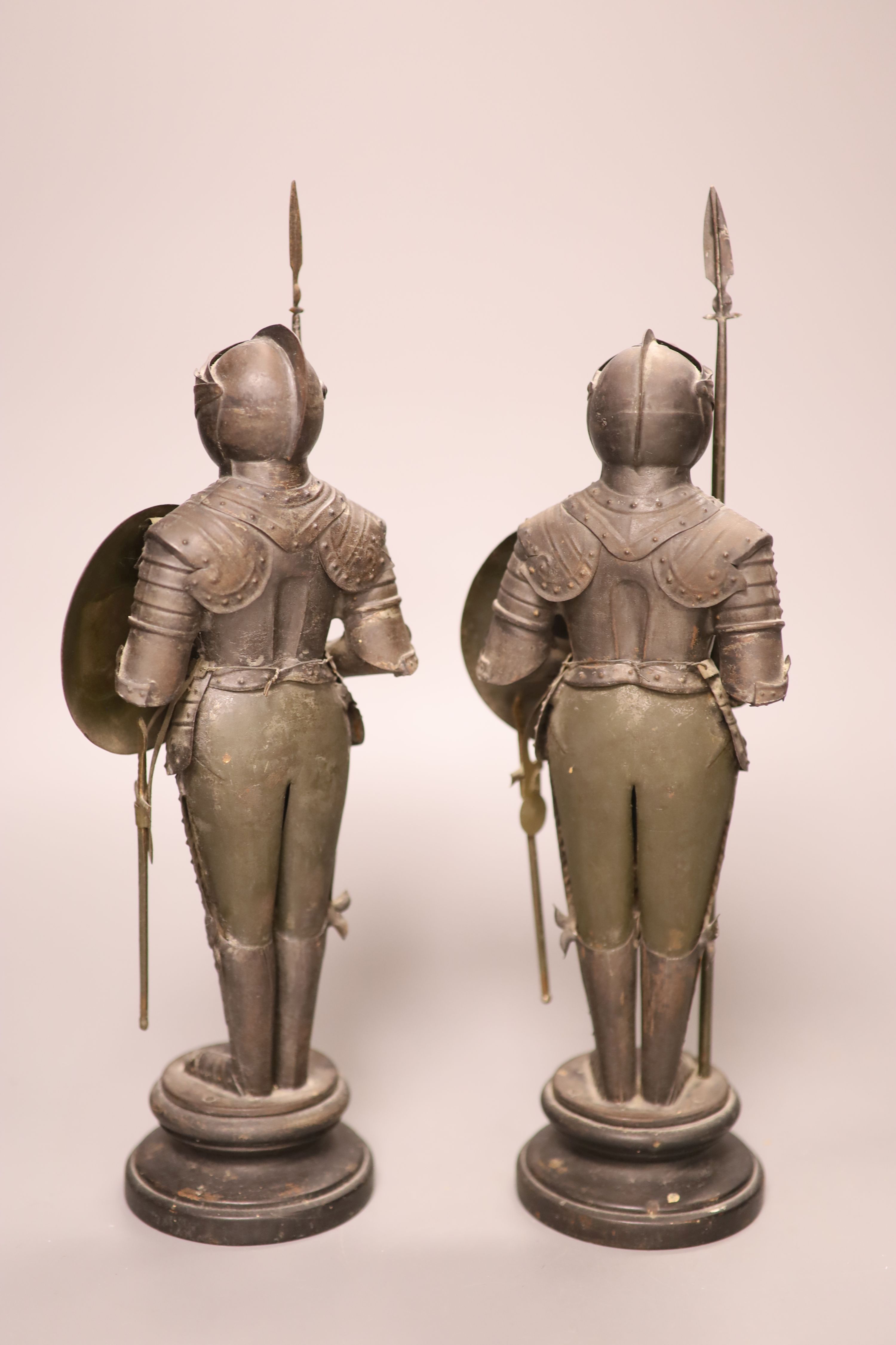 A decorative pair of tin model Maltese knights, height 31cm